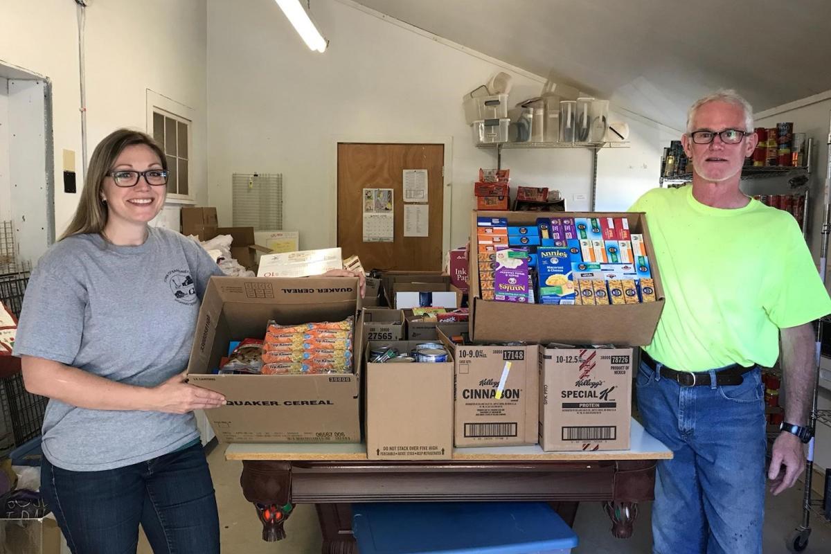 Erin Paradis and Steve Paul delivering food donations to End 68 Hours of Hunger 